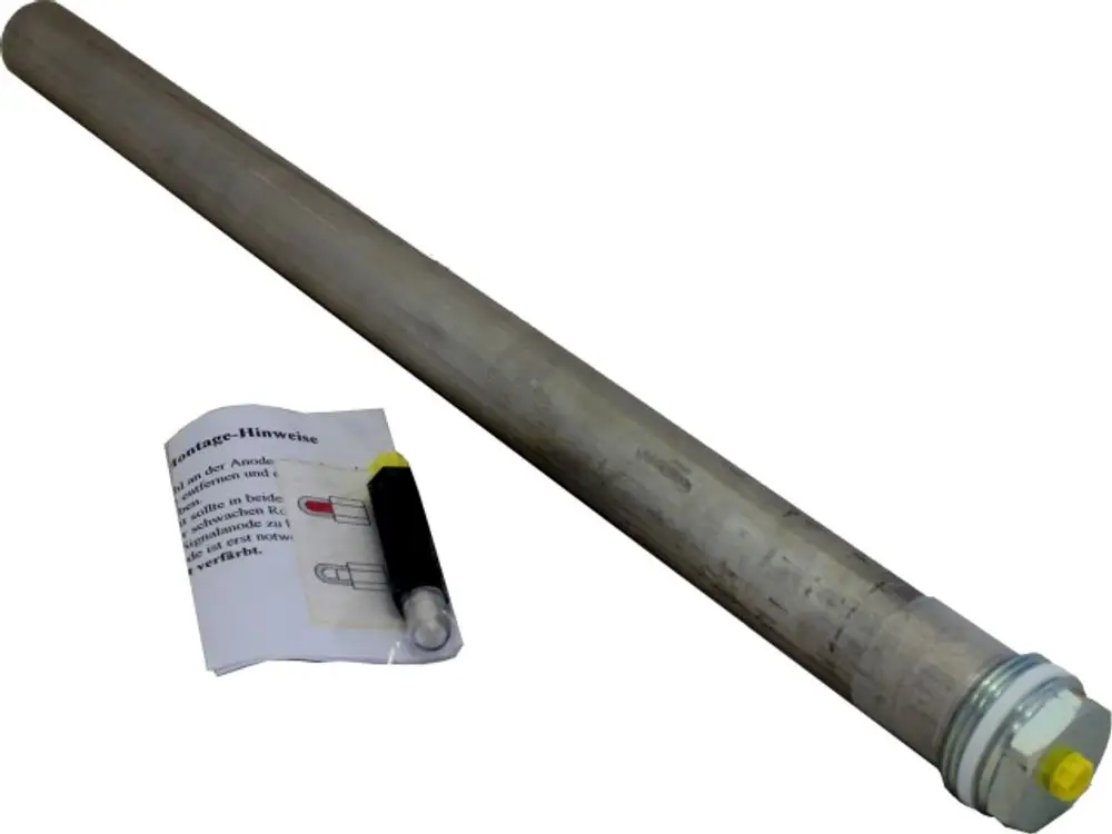 Magnesium-Schutzanode von Wolf, zylindrische Form aus Metall, mit einer dazugehörigen Anleitung und einem kleinen, markierten Bauteil zur Montage.